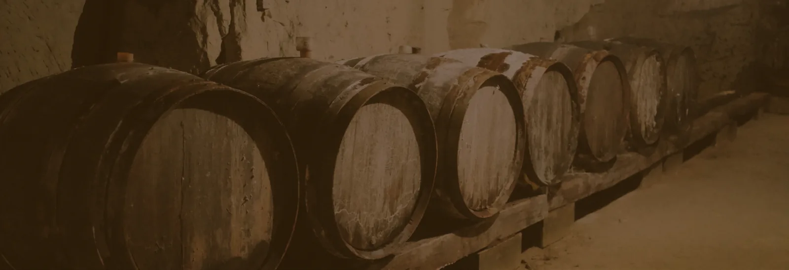 Oak barrels in a distillery setting