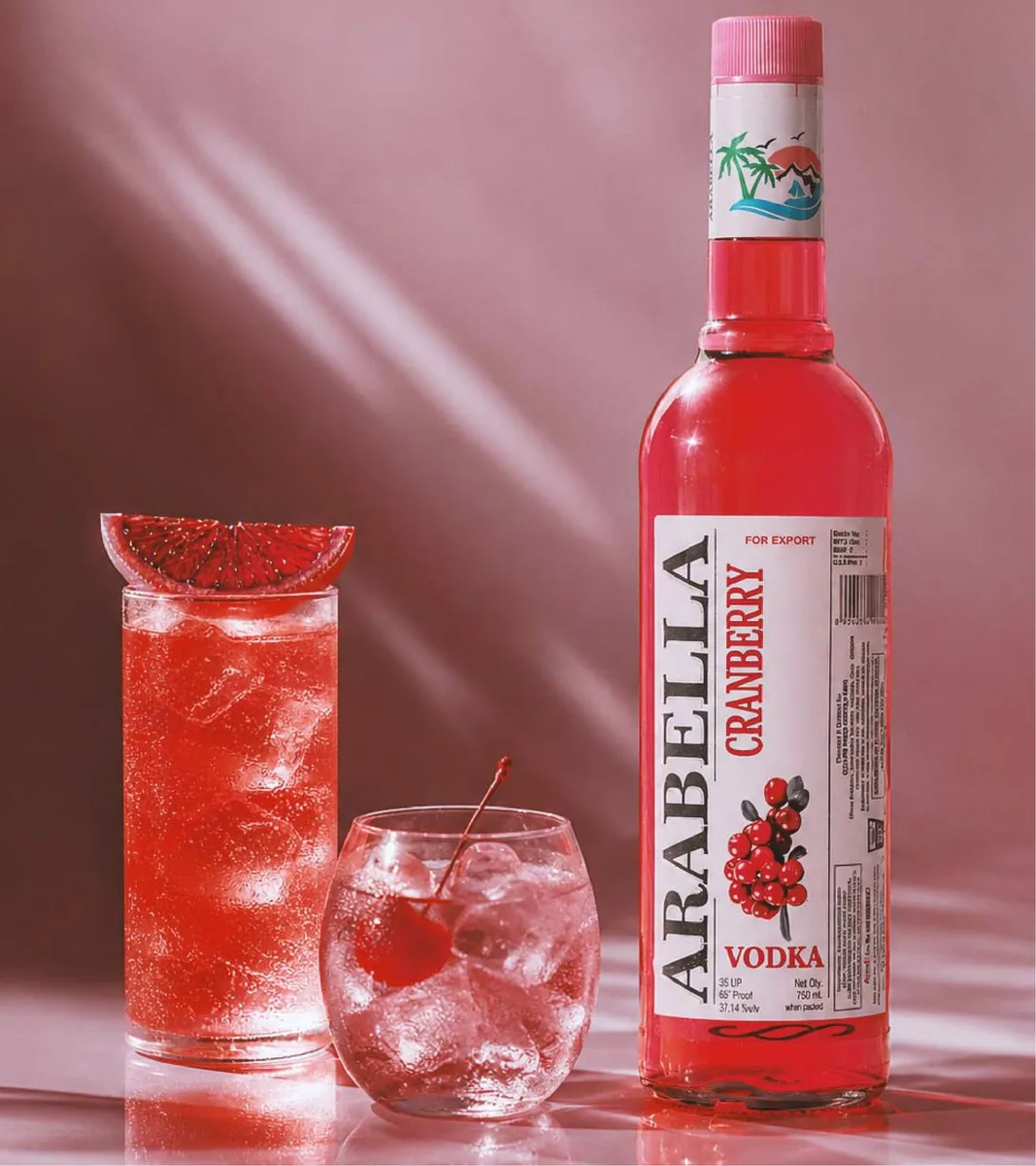Arabella Cranberry Vodka bottle beside a red drink