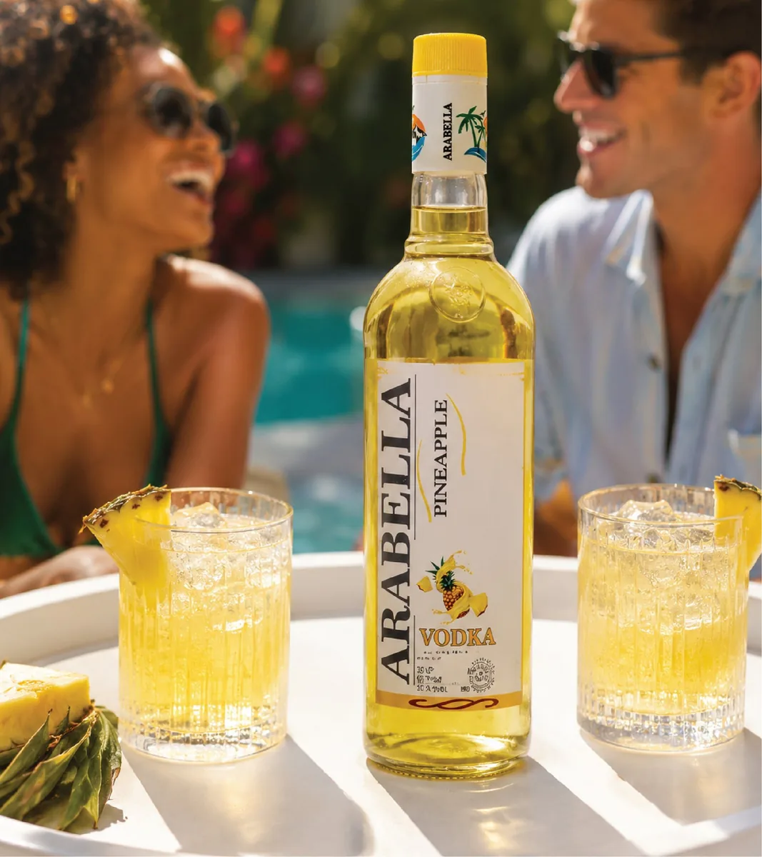 Arabella Pineapple Vodka bottle beside pineapple drinks