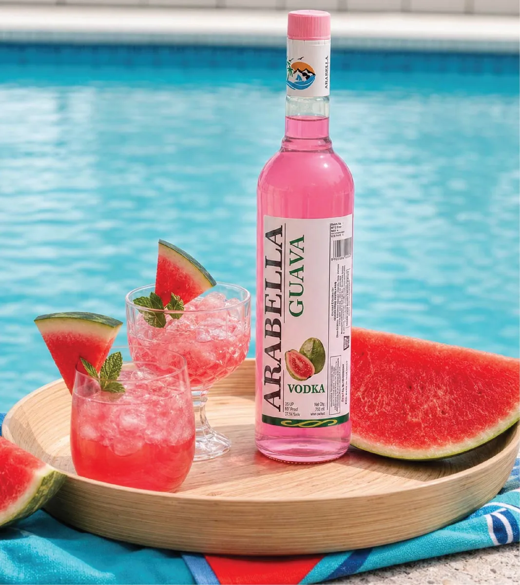 Arabella Watermelon Vodka bottle beside watermelon and drinks